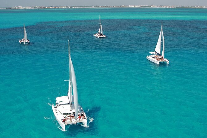 All-Inclusive Isla Mujeres Catamaran with Free Transportation - Getting started: Playa Tortugas, express check-in, and boarding fast