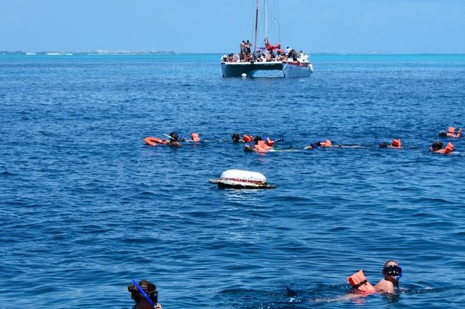 Amazing tour to the beauty Isla Mujeres with Snorkel and open bar - Isla Mujeres at an exclusive beach club: time to swim, relax, and eat