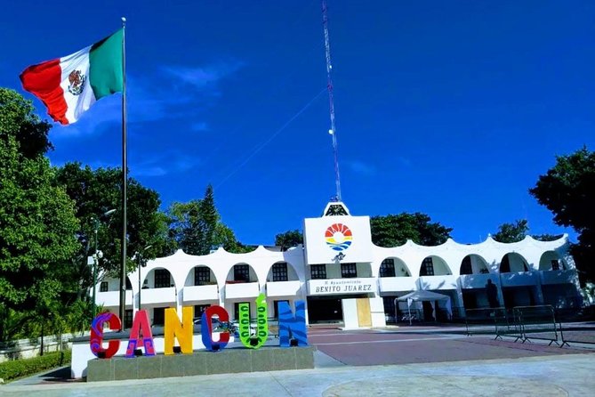 Cancun City Sightseeing and Shopping Tour on a Double Decker bus - Playa Delfines and the Cancun Sign: Photo Time With a Weather Check