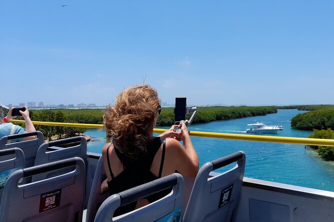 Cancun City Sightseeing and Shopping Tour on a Double Decker bus - Boulevard Kukulcan Views From the Upper Deck