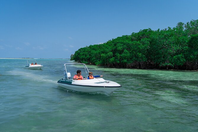 Cancun: Speedboat tour to a Virgin Beach - What costs extra: dock tax and optional photo/video