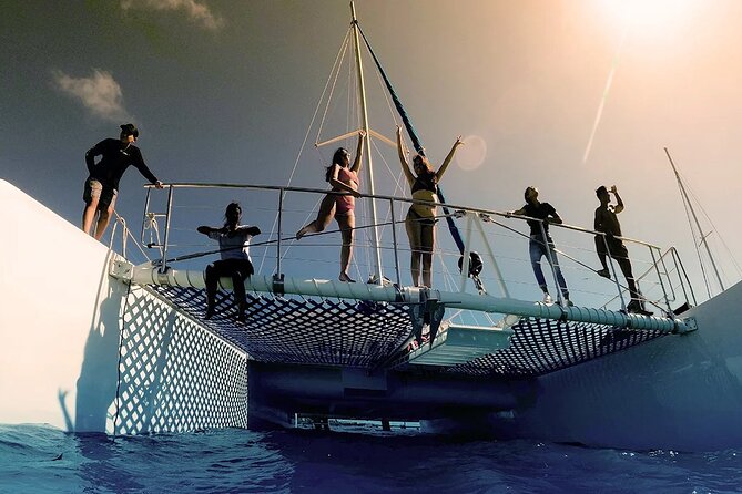 Catamaran Adventure Isla Mujeres with Snorkeling and Beach Club - Return cruise to Cancun: music, views, and a last drink