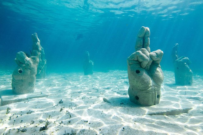 Catamaran Sailing Experience & Snorkeling Tour to Isla Mujeres - Boat Ride Vibe: Friendly Staff, Entertainment, and a Shared Day