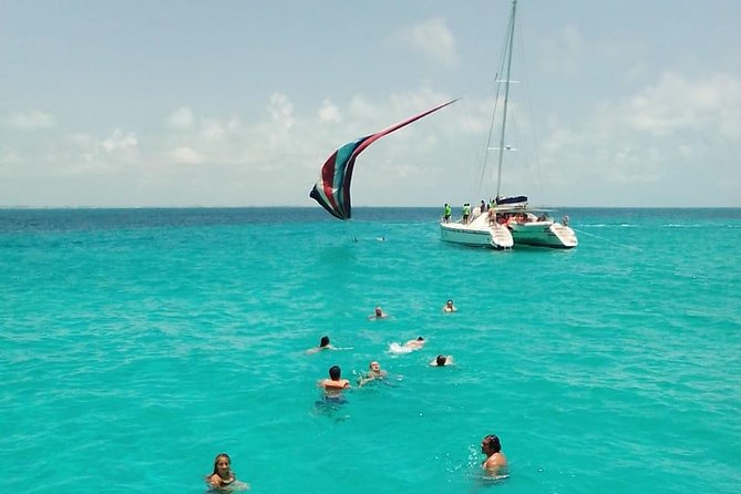 Catamaran to Isla Mujeres, Open bar, buffet, Beach Club Included - Cancún to Isla Mujeres: party vibes, music, and the spinnaker question