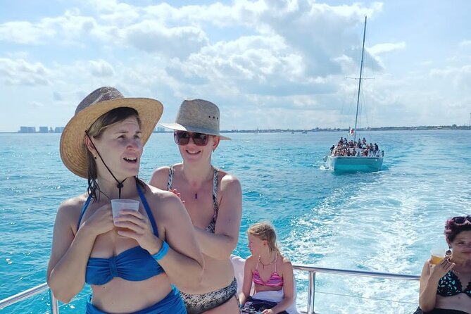 Catamaran Tour to Isla Mujeres all Included - Open bar, music, and the Ice Bar courtesy stop