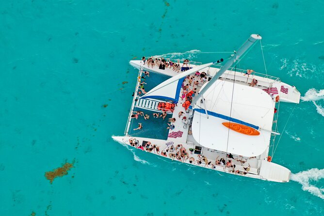 Catamaran Tour to Isla Mujeres Open bar and Lunch - One Hour in Isla Mujeres: Shopping, Sights, or a Golf Cart Moment