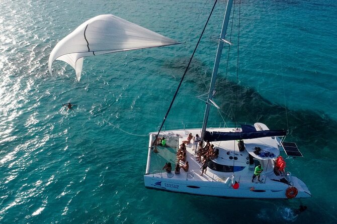 Catamaran Tour to Isla Mujeres, Open bar, Lunch, Snorkeling, Beach Club Included - From Marina Las Perlas to Isla Mujeres in One 7-Hour Swing