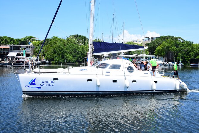 Catamaran Tour to Isla Mujeres, Open bar, Lunch, Snorkeling, Beach Club Included - Price, Dock Fee, and Whether This Feels Like a Deal