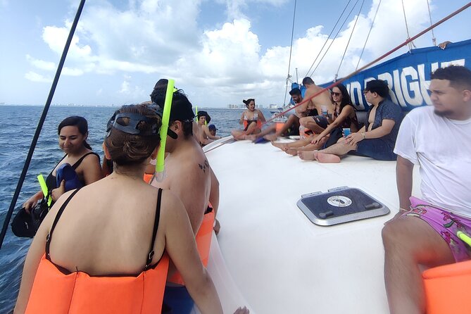 Deluxe Catamaran to Isla Mujeres, with Drinks, Snorkel & Buffet - Onboard entertainment and the open bar setup