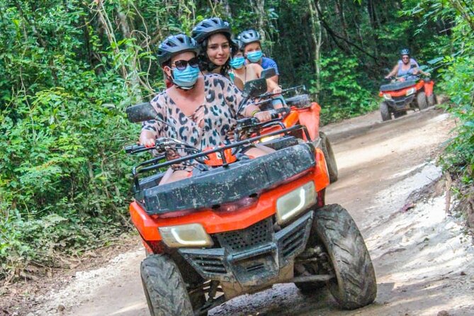 Drive an Atv shared, swim in a Cenote and ziplines in the Cancun - Cenote Swim: Sacred Water Time, Chilly Moments, and a Jump Option