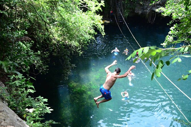 Experience ATV (shared) Ziplines & Cenote with Lunch from Cancún - Ziplining: Flying like a hawk, with jungle views
