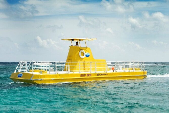Hop-on Hop-off City Tour Cancun plus Submarine or Bodyboard Experience - Kukulcan Plaza to Malecón Tajamar: city photos with a purpose