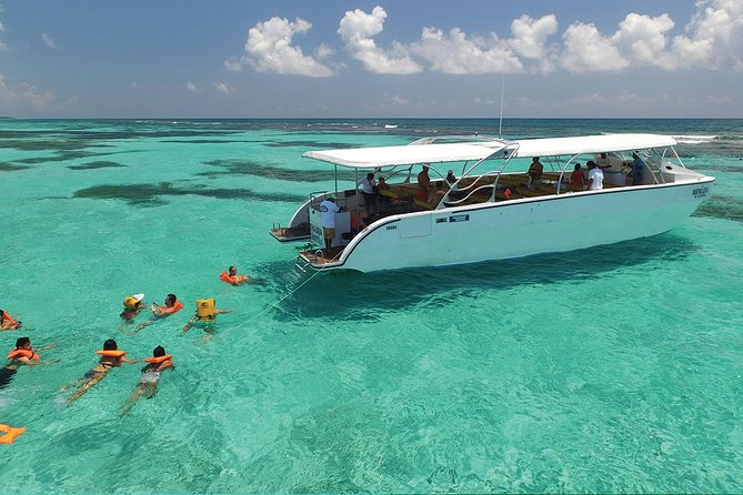 Isla Contoy and Isla Mujeres Tour with Snorkeling from Cancun - Isla Mujeres: Shopping Hour and Party Energy on the Return