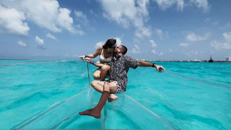 Isla Mujeres: 100% Transparent boat ride - What You Might See: Reefs, turtles, and a shipwreck moment