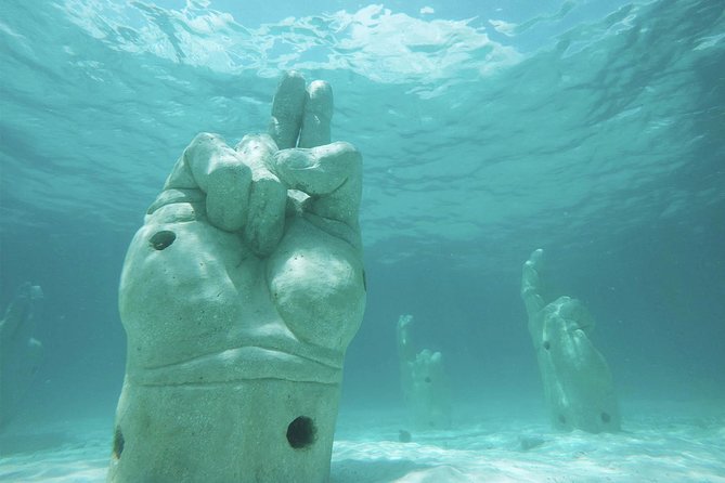Isla Mujeres Catamaran Luxury Sailing Experience - Stop 1: Zona Arqueologica El Meco snorkeling and the submarine museum sculptures