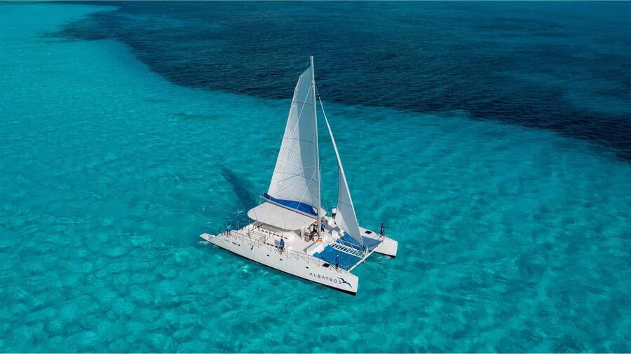 Isla Mujeres Catamaran, Snorkel & Buffet Lunch - Leaving Marina Albatros: music, drinks, and sea-breeze comfort