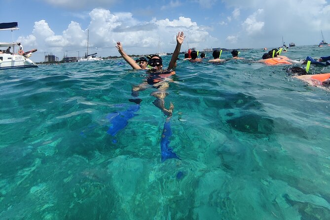 Isla Mujeres Catamaran Tour from Cancun with Snorkel and Open Bar - Isla Mujeres in 1.5 hours: shopping, photos, and quick detours