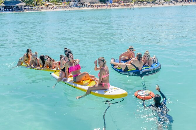 Isla Mujeres Catamaran Tour with Snorkel, Open bar and Transport - Sailing through Isla Mujeres waters: sunset views from the deck