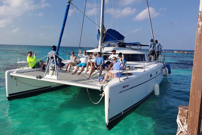 Isla Mujeres: Catamaran Tour with Snorkeling Food, Drinks, Beach - Center of Isla Mujeres: rustic streets, docks, and quick shopping