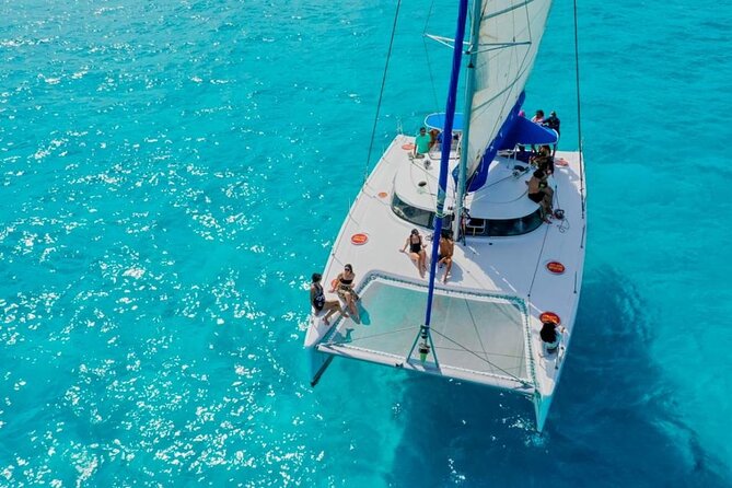 Isla Mujeres: Catamaran Tour with Snorkeling Food, Drinks, Beach - Spinnaker flight and weather reality checks