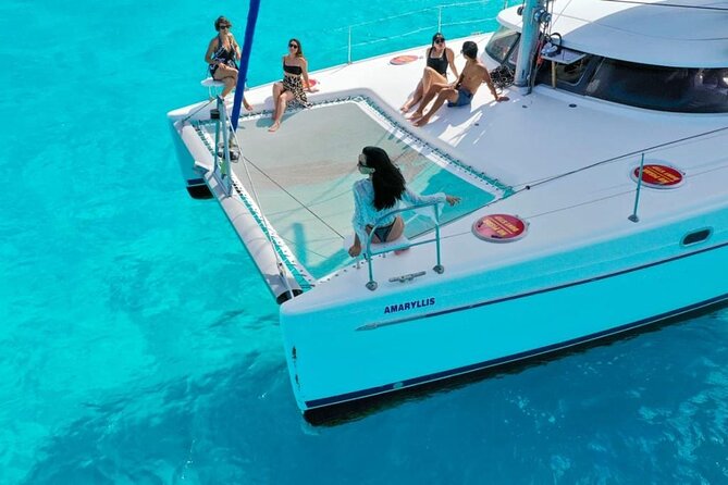 Isla Mujeres: Catamaran Tour with Snorkeling Food, Drinks, Beach - Docking at El Pececito and the 8-hour flow