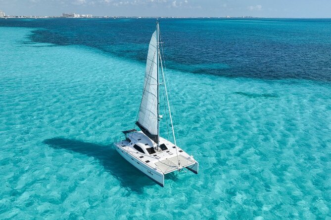 Isla Mujeres Catamaran Tour with Snorkeling, Open Bar & Buffet - Stop 1 in Isla Mujeres: 45 minutes of guided reef snorkeling