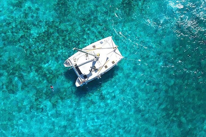 Isla Mujeres Premium Tour Transportation & Dock fee Included - The catamaran ride: where the day really starts to feel like vacation