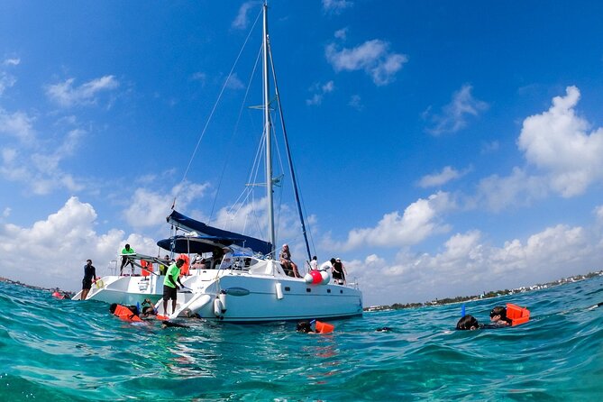 Isla Mujeres Tour on Catamaran with Snorkel, Open Bar, Buffet & Beach club - Beach club time: buffet lunch, open bar, and where the value shows up