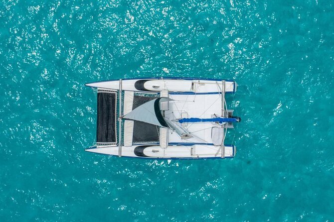 Premium Isla Mujeres Tour by Private Catamaran - Playa Tortugas return and the open bar: where the mood shifts