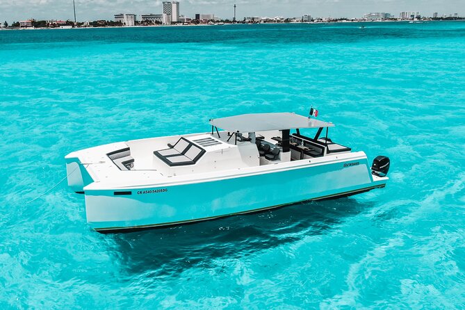 Private Atomic Catamaran Tour to Isla Mujeres - On board with hosts, smooth sailing, and an adult-only open bar