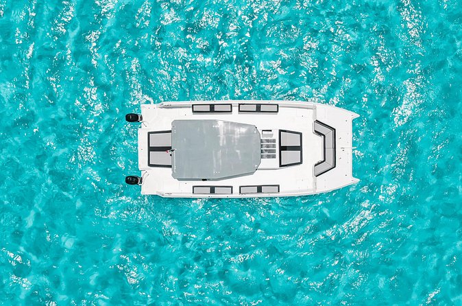 Private Atomic Catamaran Tour to Isla Mujeres - What’s not included: dock tax, photos, and tips