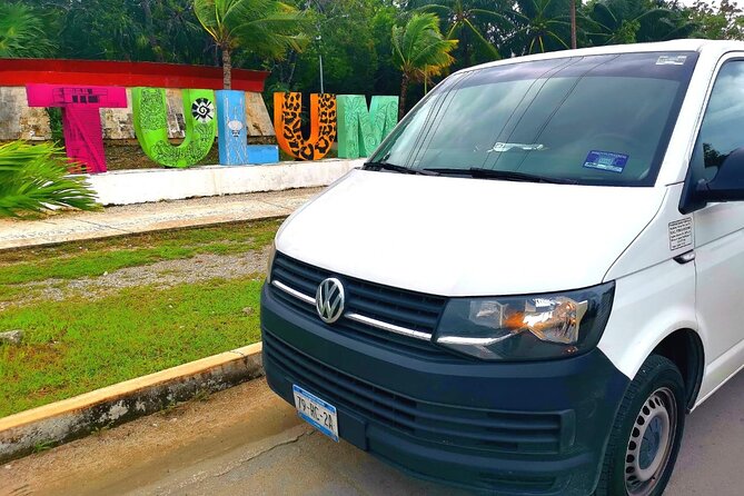 Private Transfer-Cancun Airport to Tulum Downtown - One Way - Cancun Airport Pickup: Banner, Bar Area, and a Clear Meeting Point