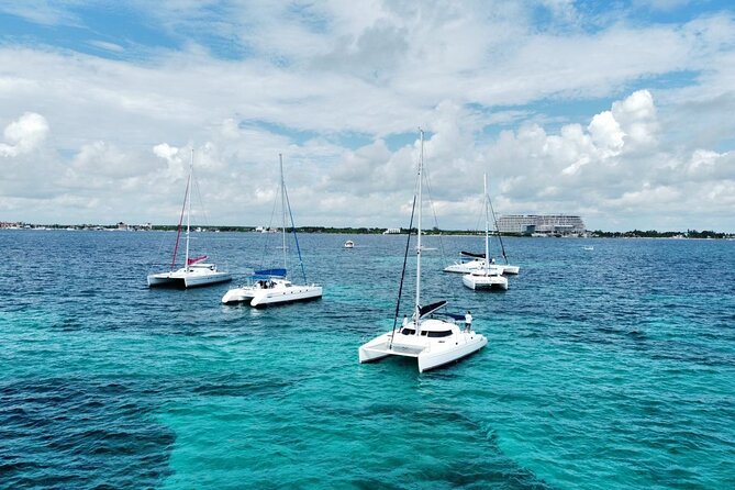 Splendid Isla Mujeres Catamaran: drinks and fun all day! - Arrecife El Meco snorkeling: gear is included, safety is part of the plan