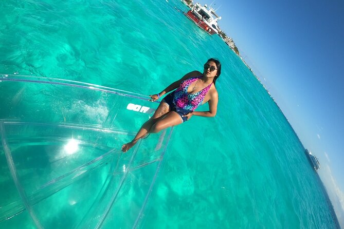 Tour Isla Mujeres excursion in Collective Transparent Boat - El Farito reef: where the fish variety tends to show up